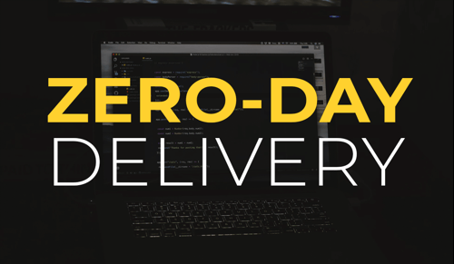 Zero-day delivery in front of a laptop showing code